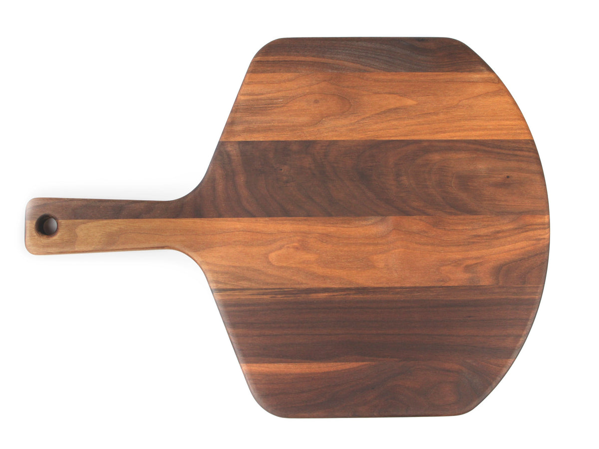 Walnut pizza peel, 22 x 16 in, straight overhead view on white with the handle to the left