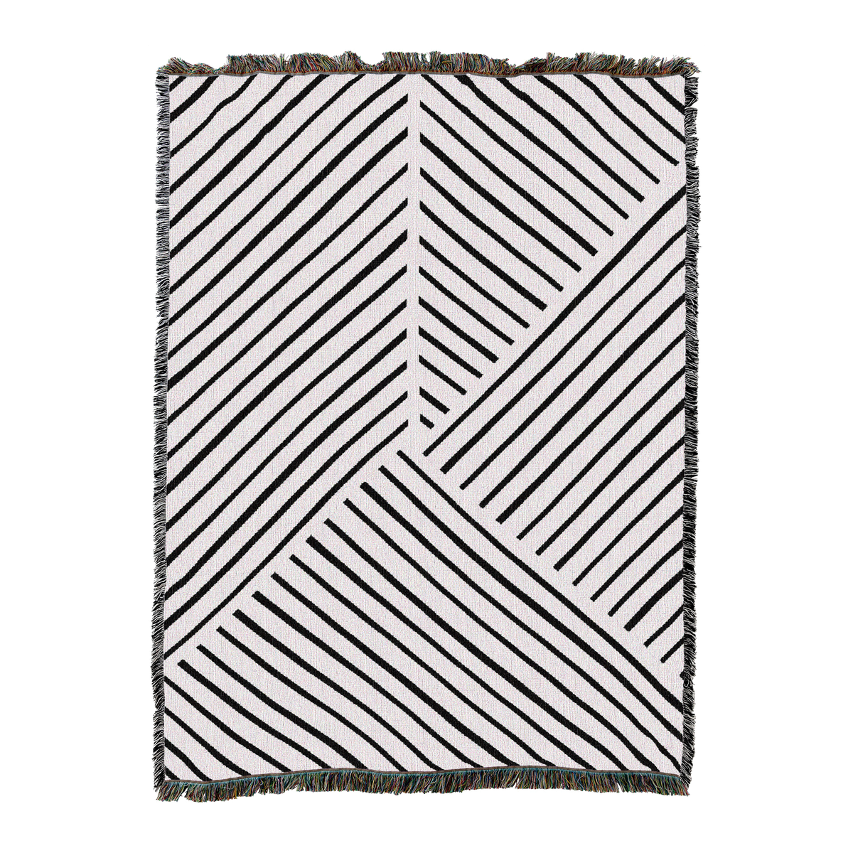 Woven blanket in white with black diagonal line panels meeting at angles and a short fringed edge, laid flat
