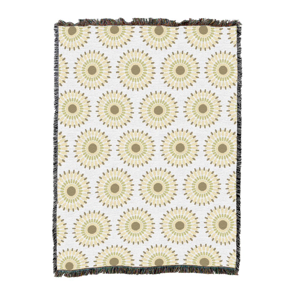 Woven cotton throw with rows of sand-colored sunbursts on a white ground, shown flat with fringed edges