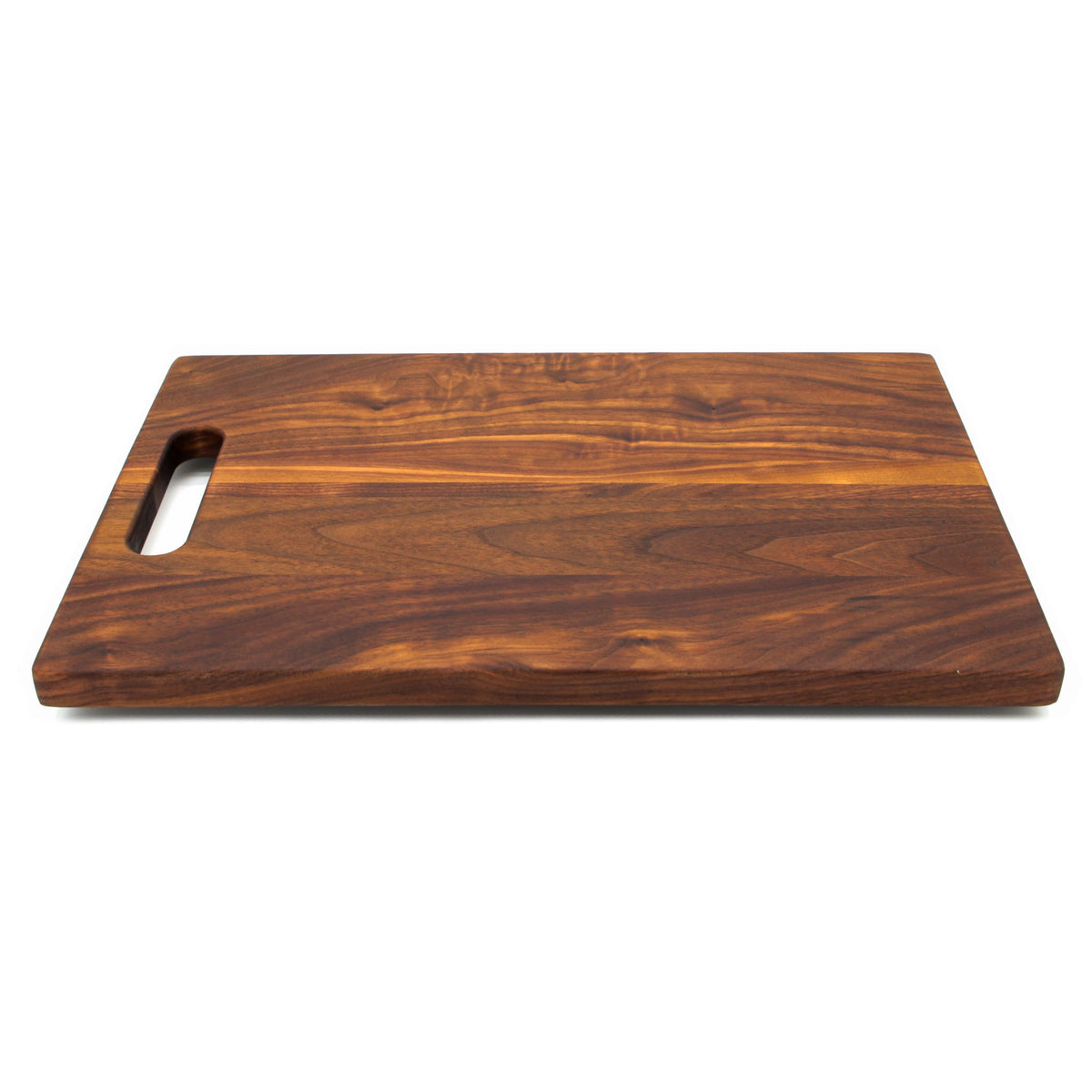 Walnut single handle cutting board, 16 x 10.5 in, low angled view with a pale sapwood streak
