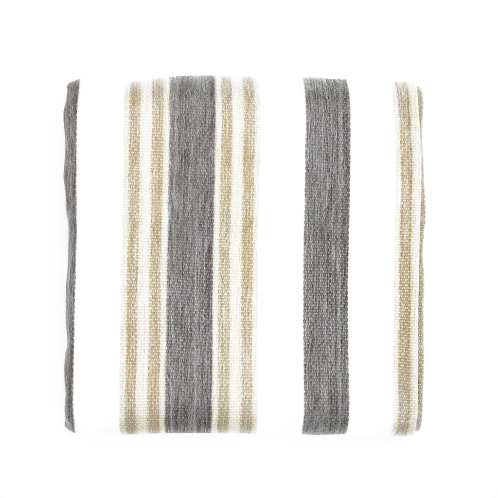 Cream alpaca throw with charcoal and camel stripes laid flat and folded on a white background