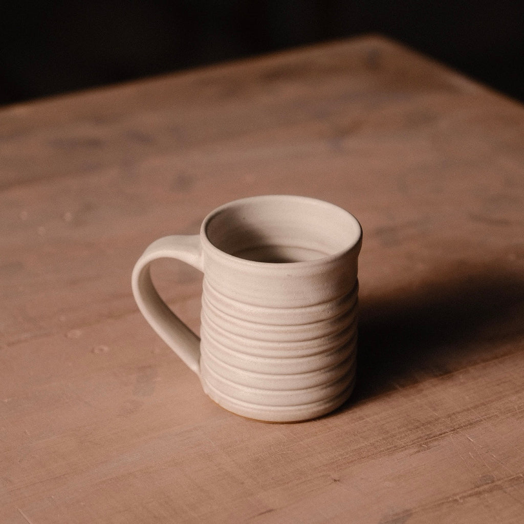 Hand-Thrown Stoneware Little Mug photographed on a bone white surface in soft natural light