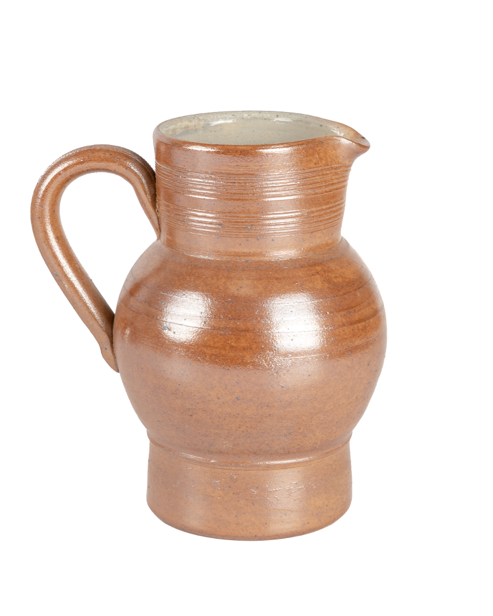 Vintage salt-glazed French ceramic pitcher in speckled toffee brown with potter's rings, shown against black