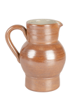 Vintage salt-glazed French ceramic pitcher in speckled toffee brown with potter's rings, shown against black