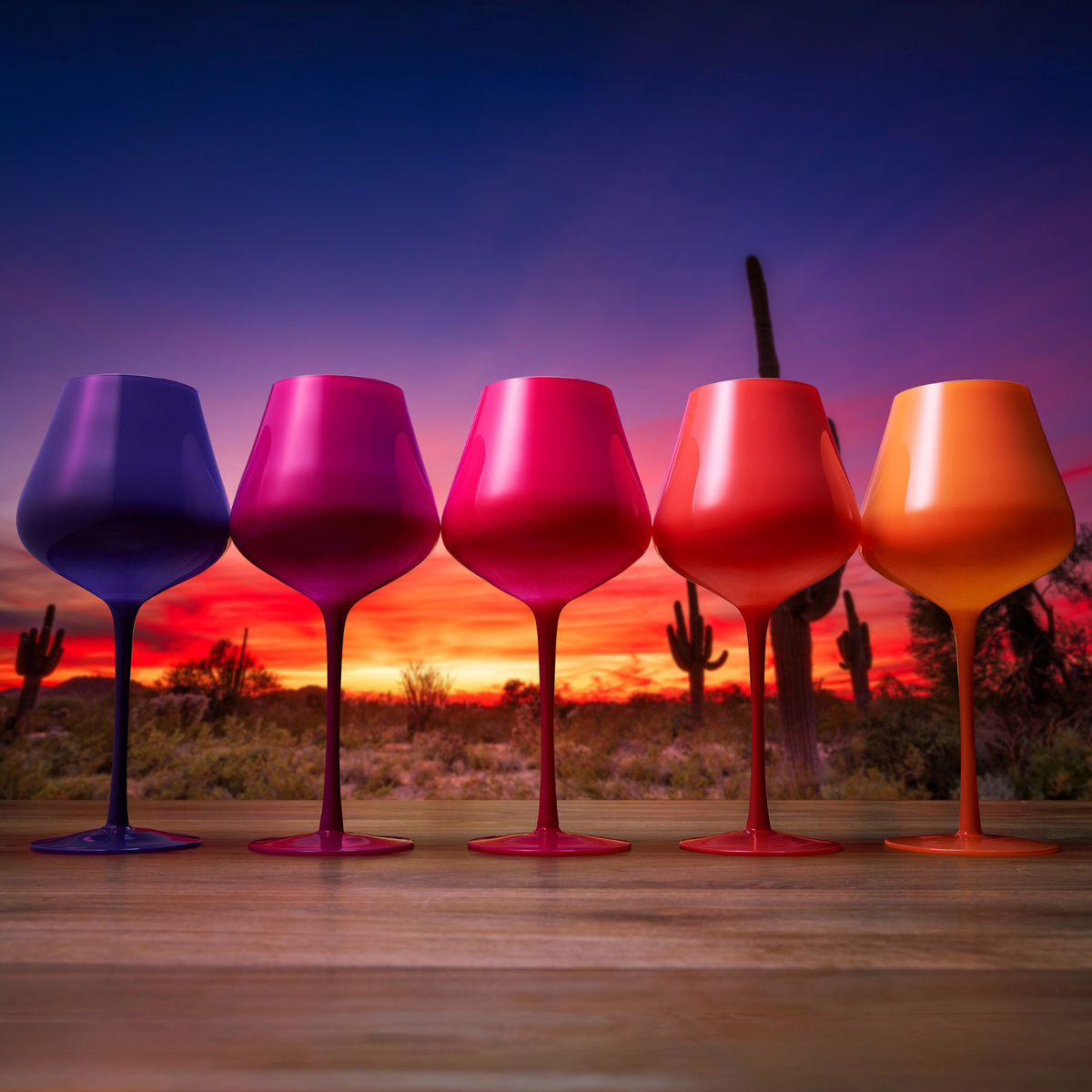 Southwest Sunset Gradient Wine Glassware shown beside companion pieces from the same maker's line