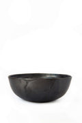 Single matte black stoneware salad serving bowl shown on a plain white background