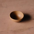 Tiny Hand-Thrown Stoneware Bowl photographed on a bone white surface in soft natural light