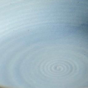 Tiny Hand-Thrown Stoneware Bowl in a closer view of the silhouette against a white ground