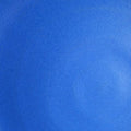 Close-up of a saturated bright blue glaze with a matte surface on Texas stoneware, a swatch for the Fat Rim dinner plate
