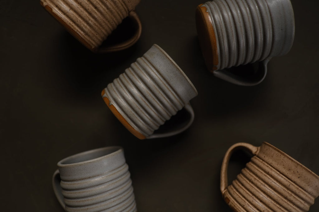 Hand-Thrown Stoneware Little Mug shown from a second angle against a pale neutral backdrop