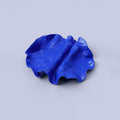 Folded Blue Porcelain Catchall Tray photographed on a bone white surface in soft natural light