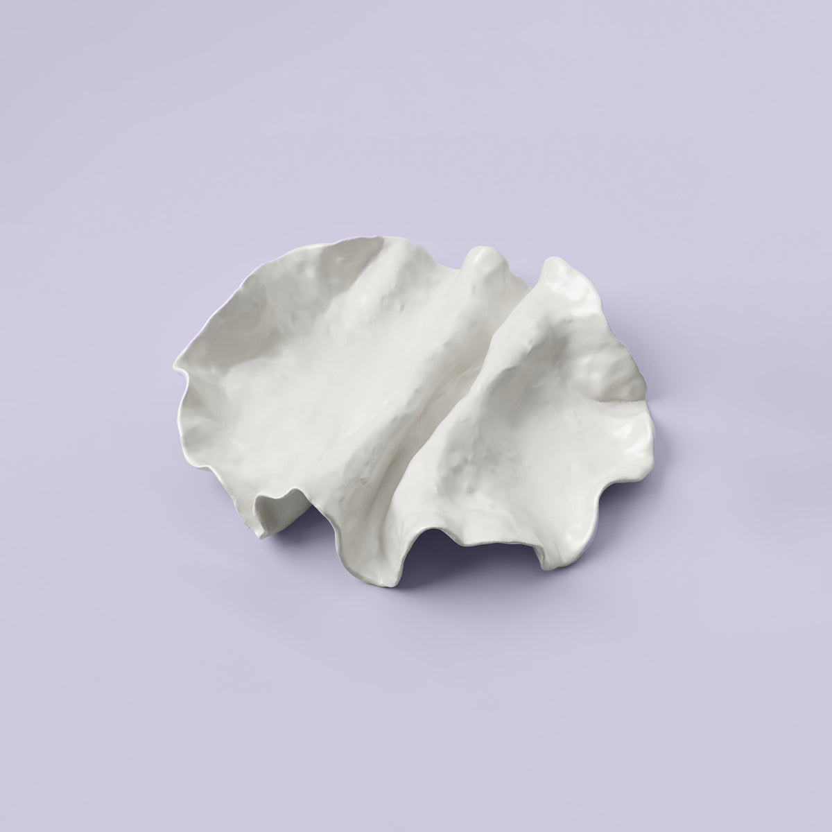 Folded White Porcelain Catchall Tray photographed on a bone white surface in soft natural light