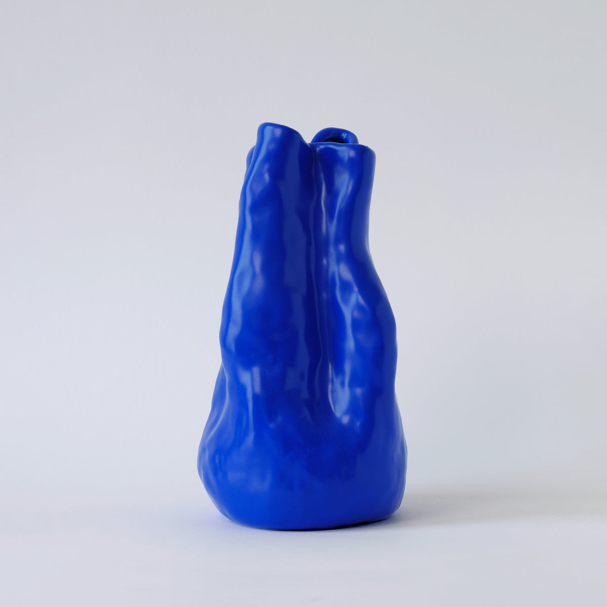Sculpted Cobalt Blue Porcelain Vase in a detail view showing surface texture and finish up close