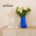 Tall Cobalt Blue Porcelain Vase photographed on a bone white surface in soft natural light