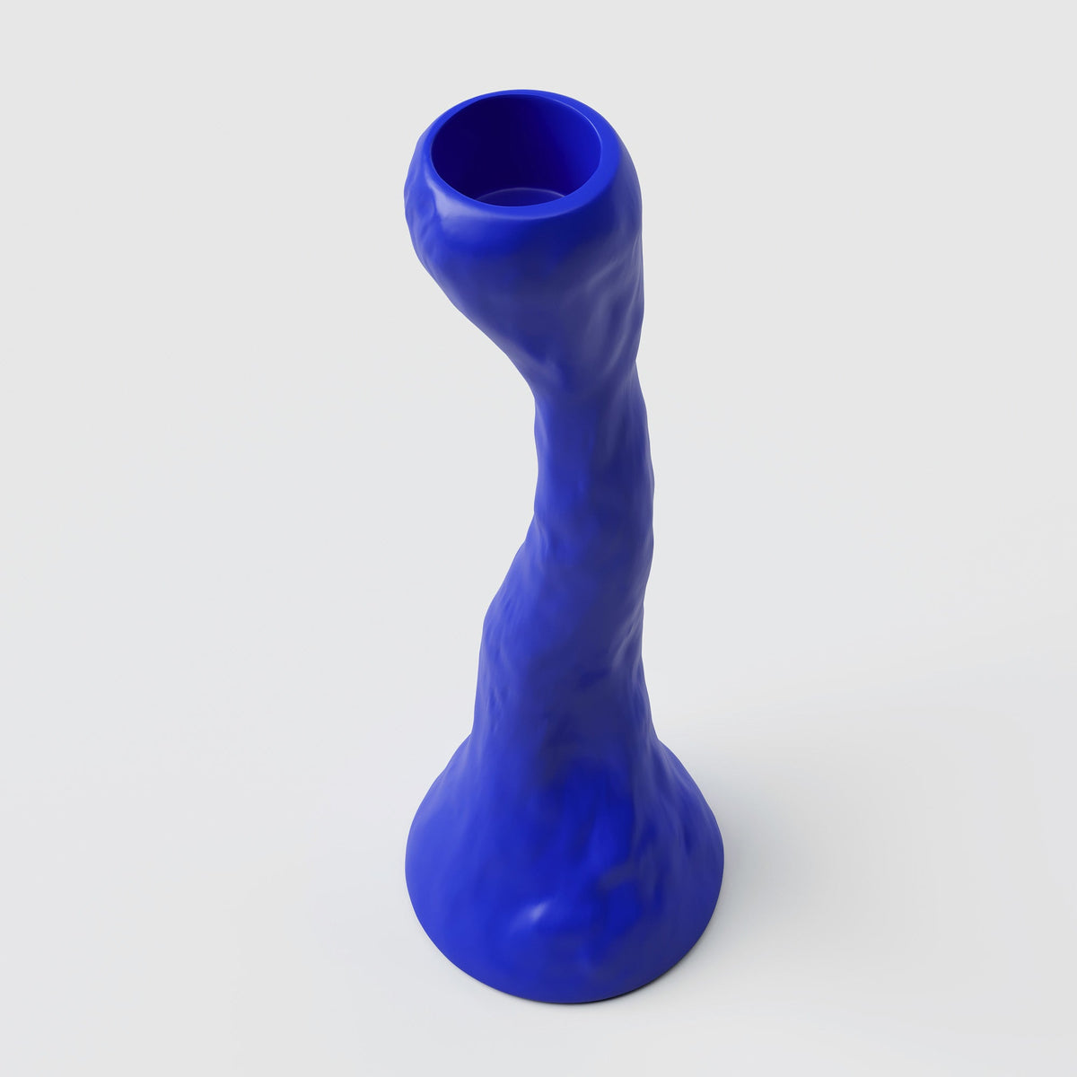 Tall Cobalt Porcelain Candle Holder photographed on a bone white surface in soft natural light