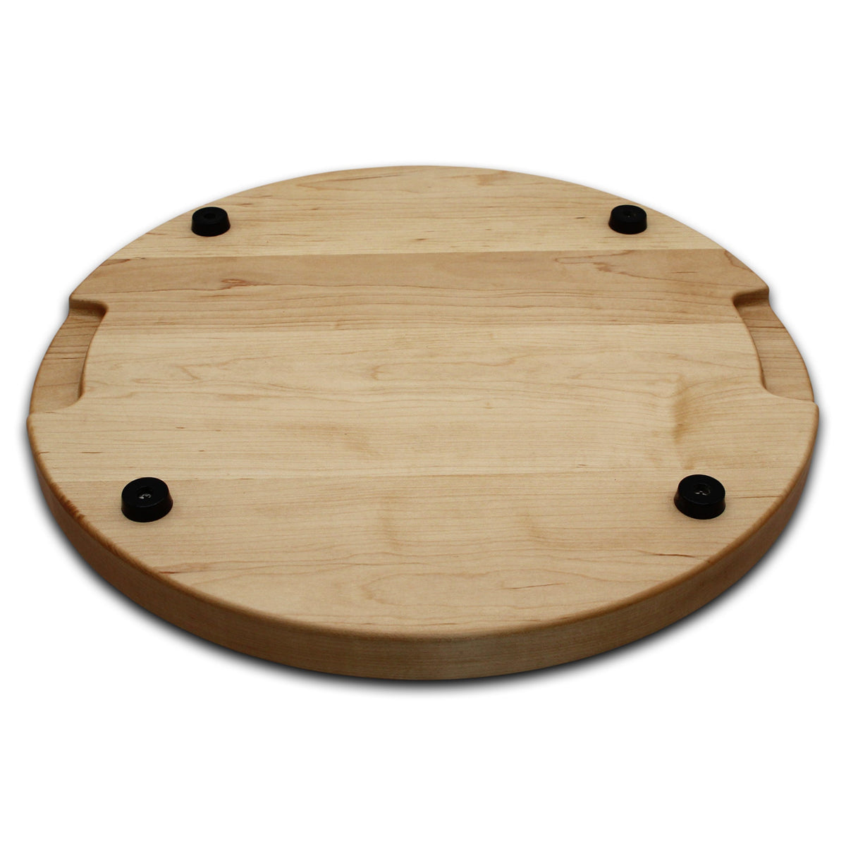Thick round maple cutting board, 18 in, angled view of the underside with pocket handles and rubber feet