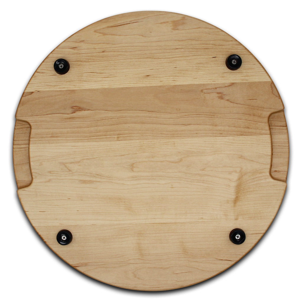 Thick round maple cutting board, 18 in, overhead view of the underside with pocket handles and feet