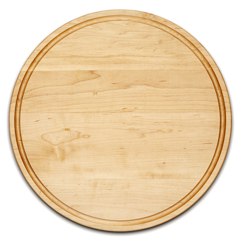 Thick round maple cutting board with a juice groove, 18 in, overhead view on white