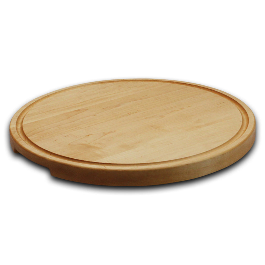 Thick round maple cutting board with a juice groove, 18 in, low angled view showing the thick edge