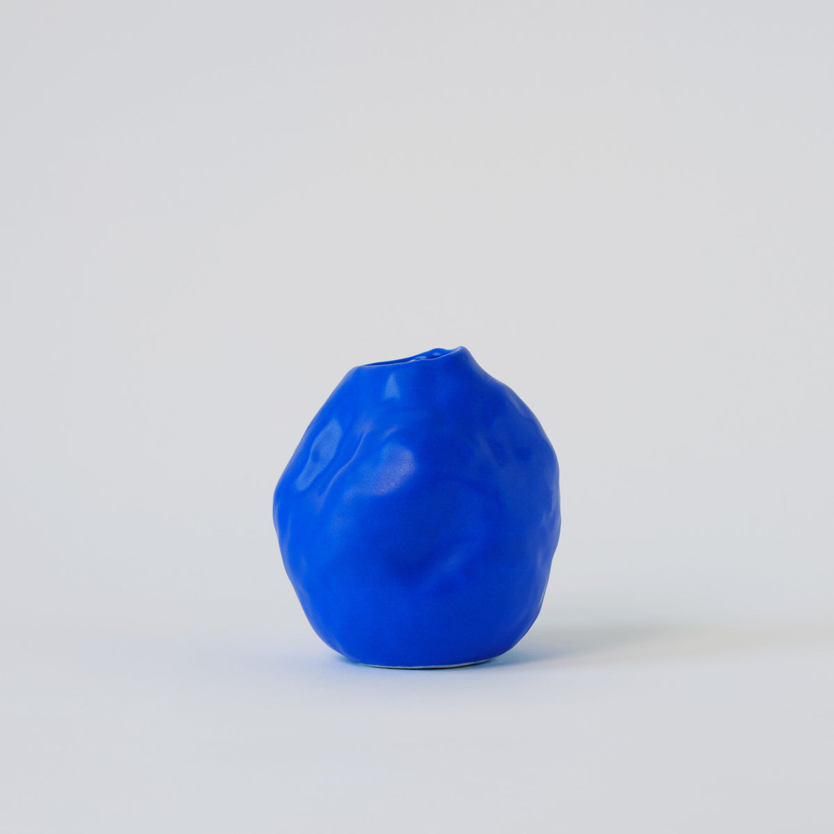 Cobalt Blue Porcelain Bud Vase in a detail view showing surface texture and finish up close