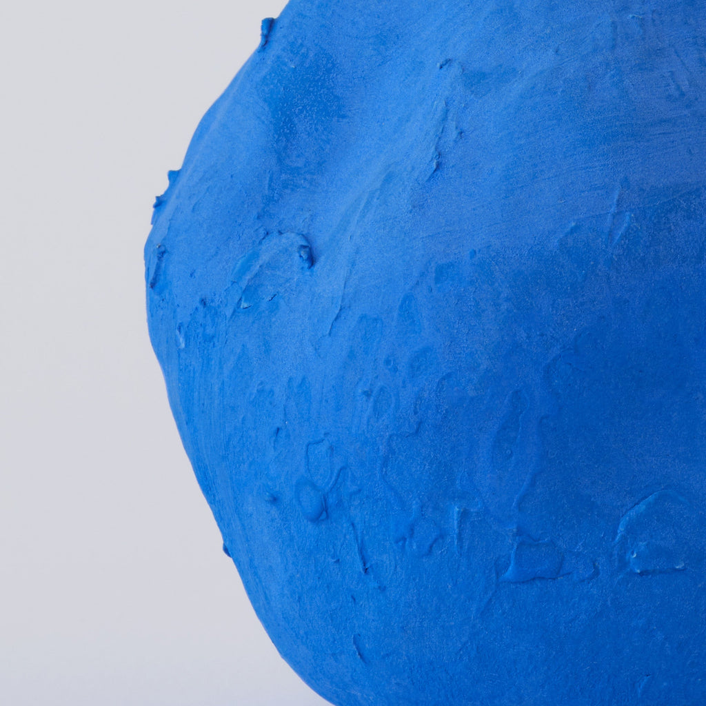 Matte Blue Porcelain Bud Vase in a detail view showing surface texture and finish up close