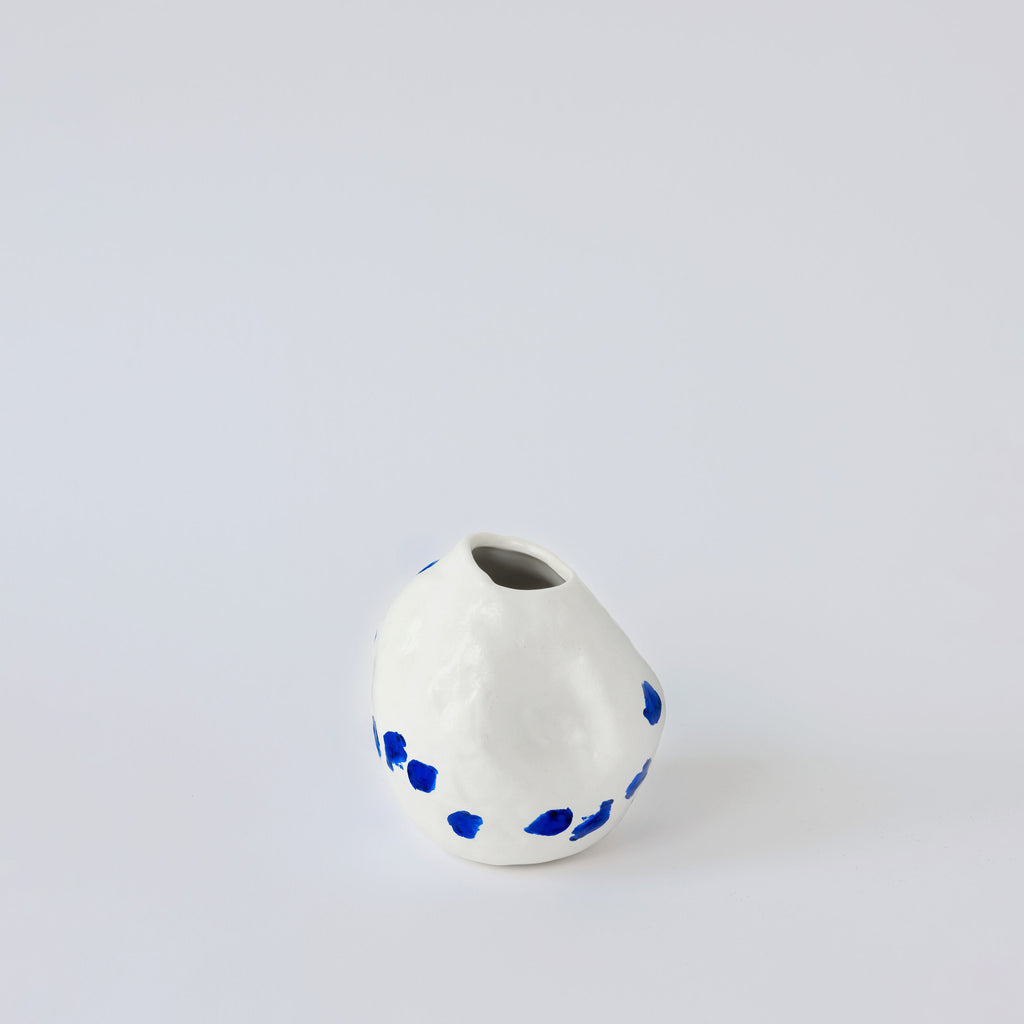 White and Blue Porcelain Bud Vase in a detail view showing surface texture and finish up close