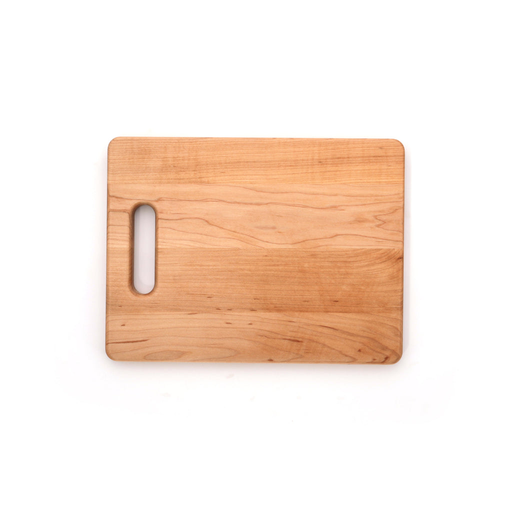 Maple single handle cutting board, 12 x 9 in, front view on white with the cut-in handle at left