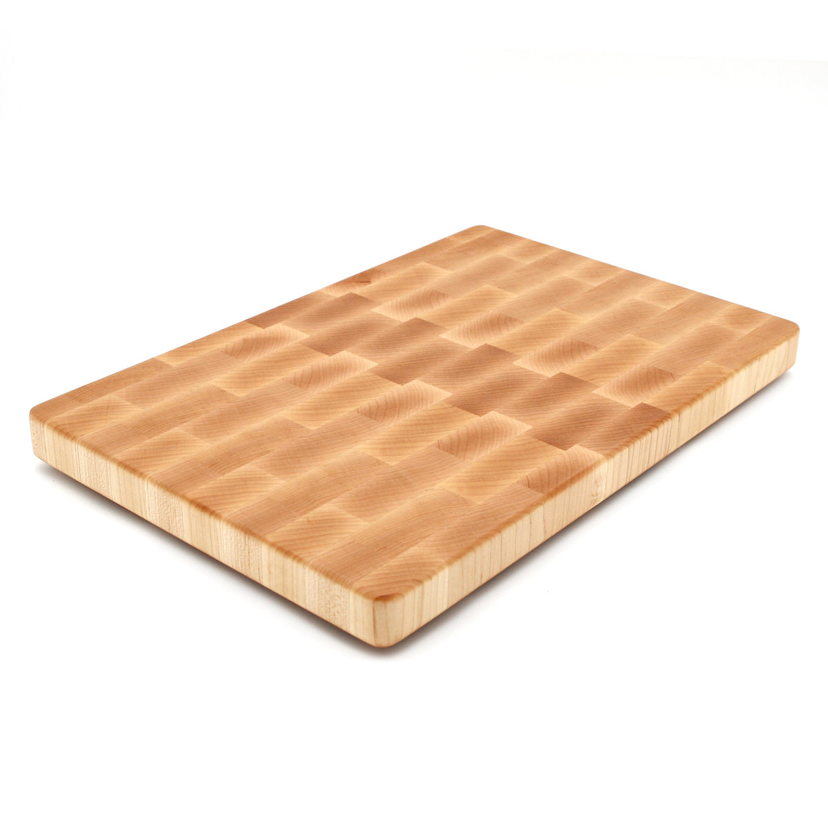 End grain maple cutting board, 18 x 12 in, lying at an angle on white with a pale brick pattern