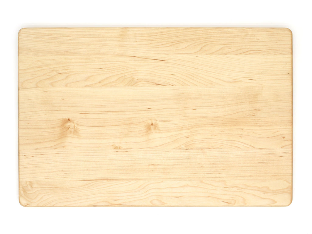 Maple cutting board, 18 x 12 in, overhead view of the plain face with light knotted grain