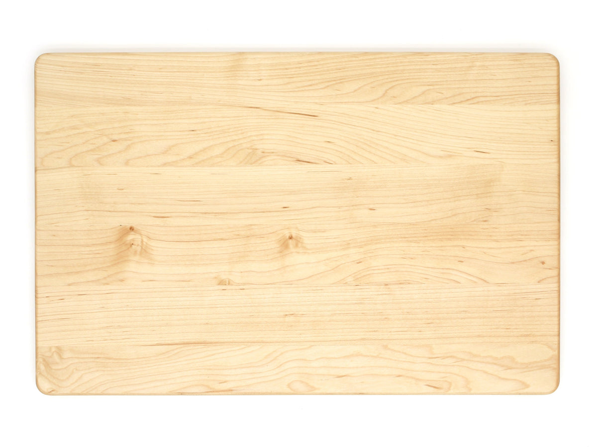 Maple cutting board, 18 x 12 in, overhead view of the plain face with light knotted grain