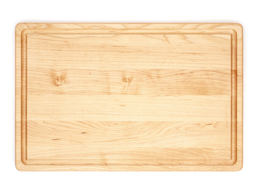 Maple cutting board with a juice groove, 18 x 12 in, straight overhead view on white