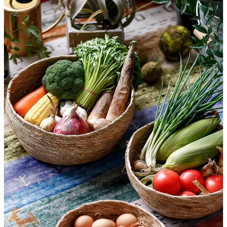 Seagrass bowl baskets in natural khaki filled with broccoli, carrots, onions and green onions