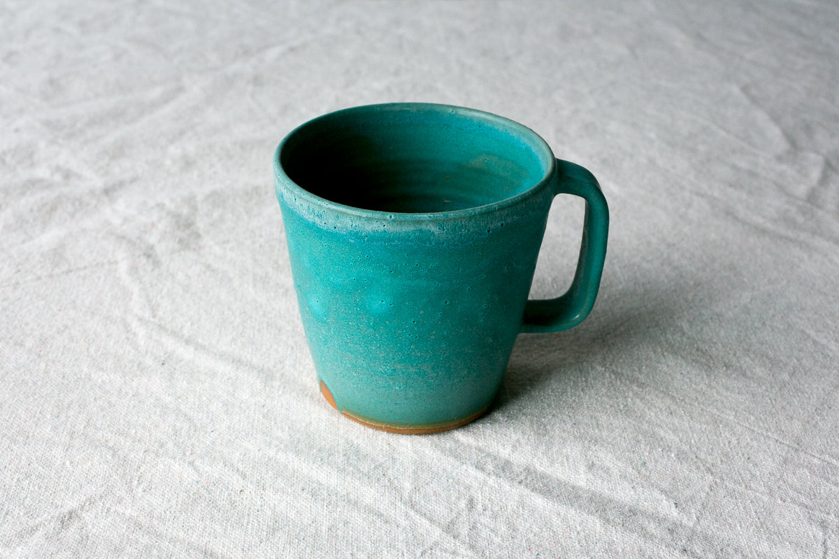 Hand-Thrown Stoneware Americano Mug shown from a second angle against a pale neutral backdrop