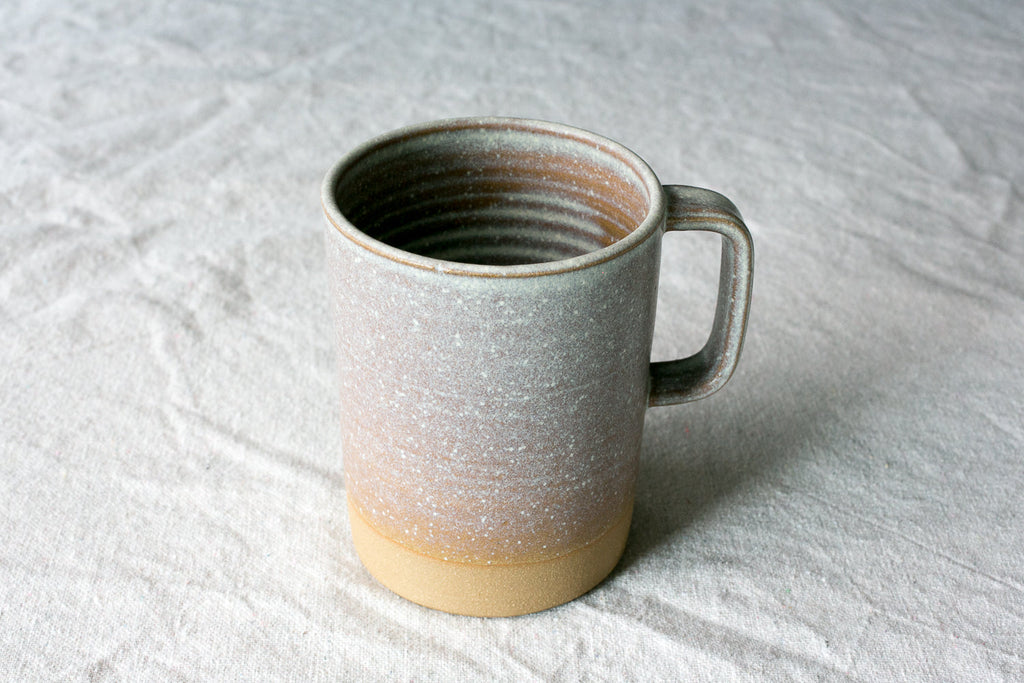Hand-Thrown Stoneware Cappuccino Mug photographed on a bone white surface in soft natural light