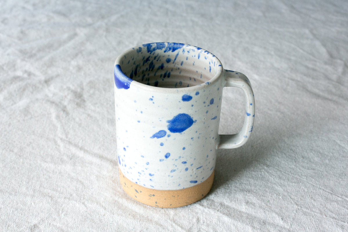 Hand-Thrown Stoneware Cappuccino Mug shown from a second angle against a pale neutral backdrop