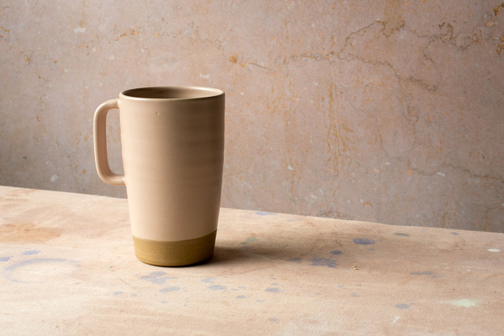Hand-Thrown Stoneware Latte Mug shown from a second angle against a pale neutral backdrop
