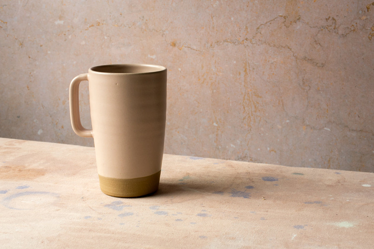 Hand-Thrown Stoneware Latte Mug shown from a second angle against a pale neutral backdrop