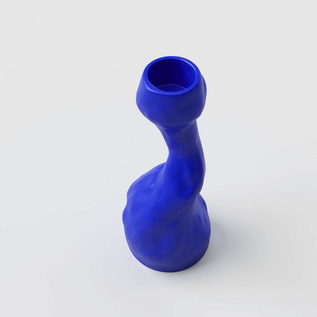 Curved Cobalt Porcelain Candle Holder shown from a second angle against a pale neutral backdrop