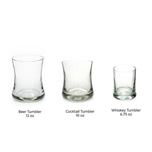 Three recycled glass tumblers in beer, cocktail and whiskey sizes shown side by side with labels