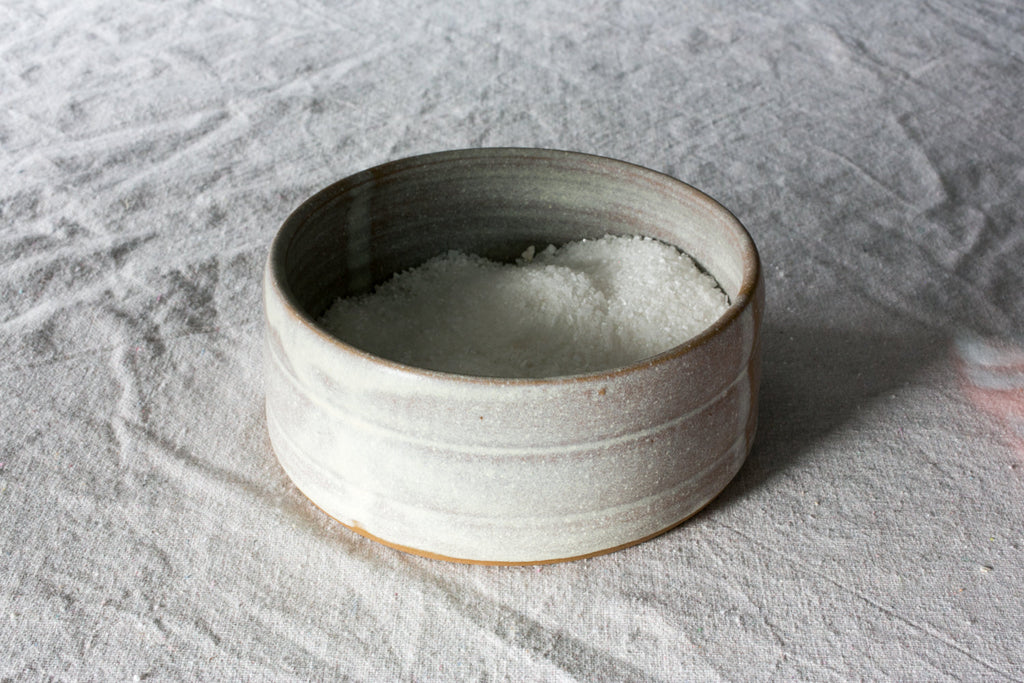 Open Hand-Thrown Stoneware Salt Pig photographed on a bone white surface in soft natural light