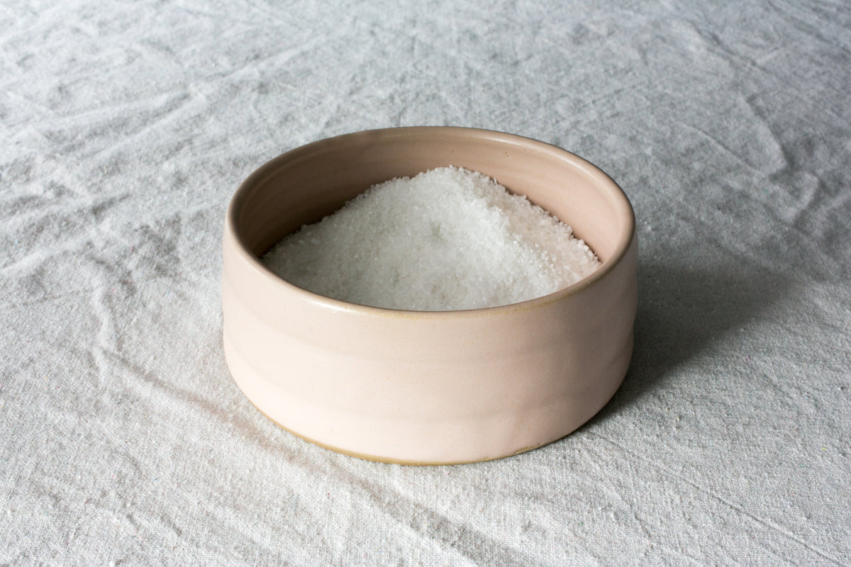 Open Hand-Thrown Stoneware Salt Pig shown from a second angle against a pale neutral backdrop
