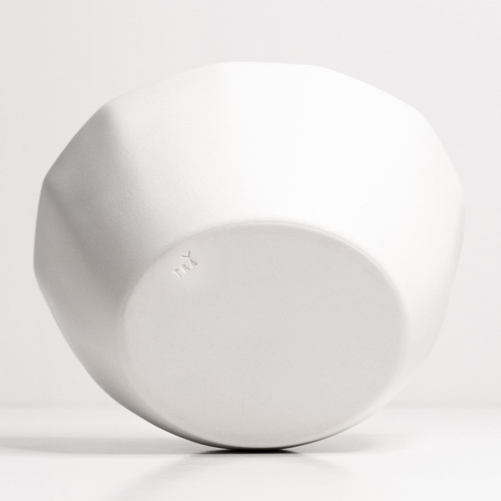 Underside of the large Silk White porcelain serving bowl showing its faceted walls and unglazed foot ring
