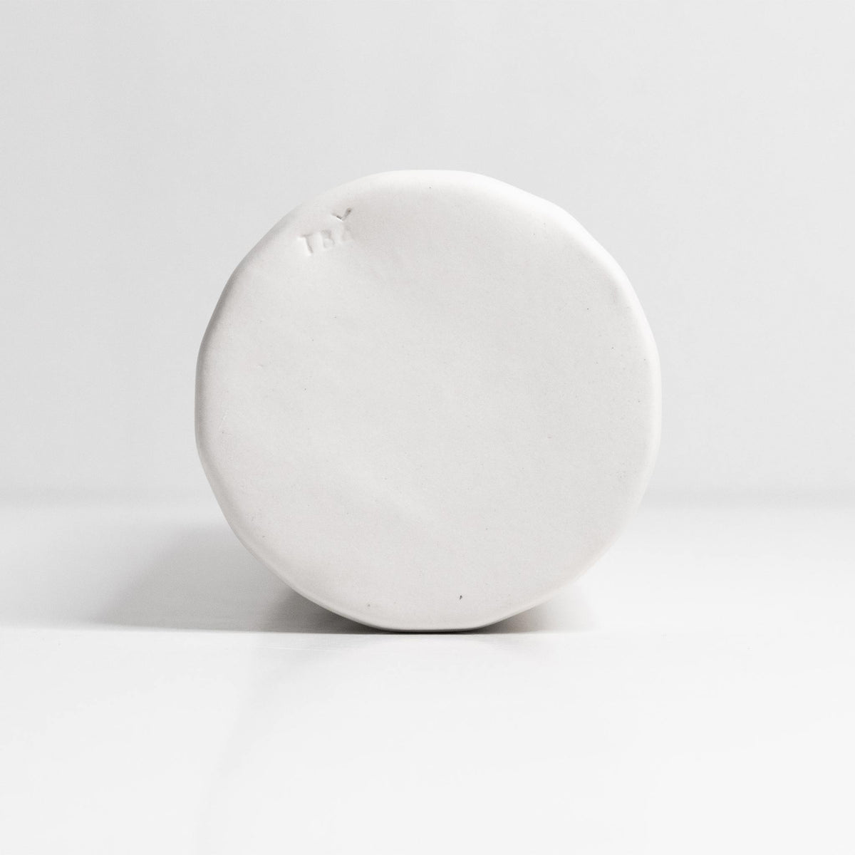 Porcelain Olive Oil Dispenser shown at an angle that catches the light across the surface