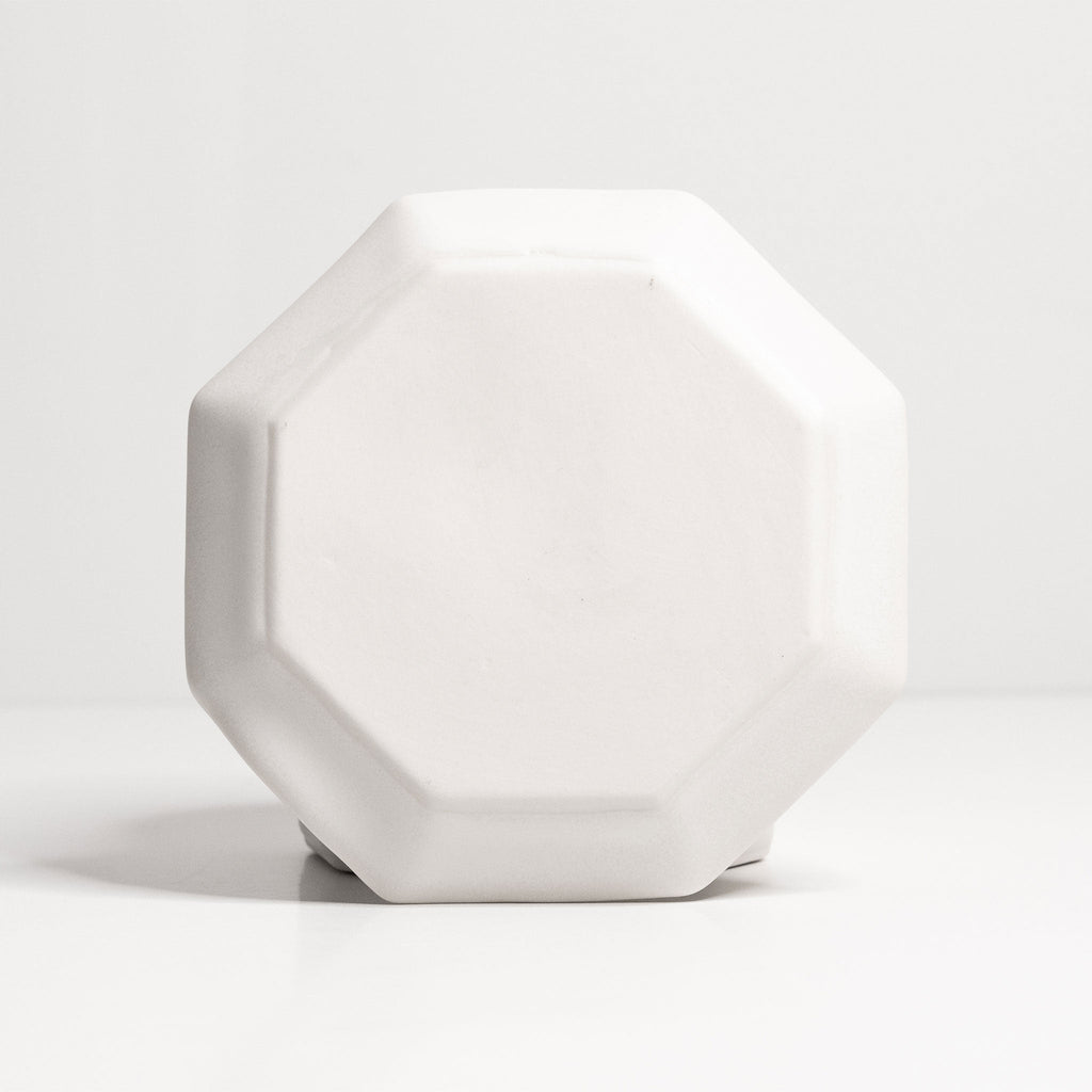 Octagonal Glazed Porcelain Spoon Rest shown in use on a casually set gathering table at dinner