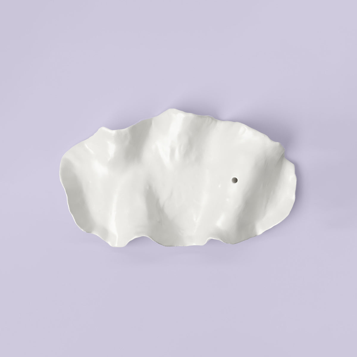 White Porcelain Incense Holder photographed on a bone white surface in soft natural light
