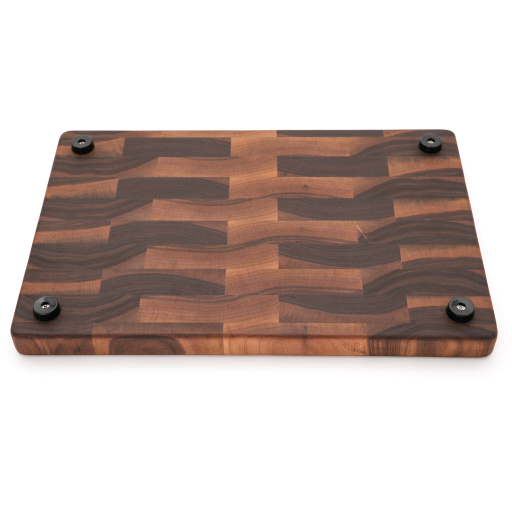 End grain walnut cutting board, 18 x 12 in, angled view of the underside with rubber feet