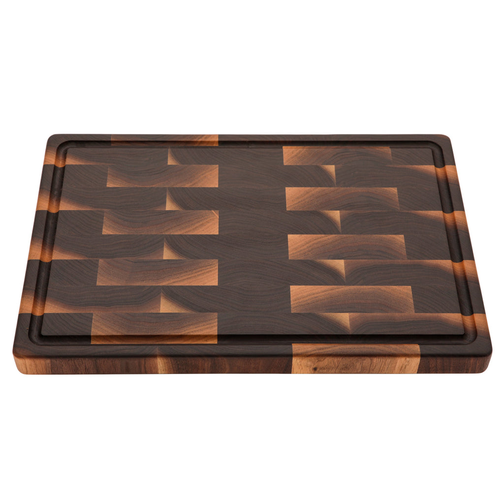 End grain walnut cutting board with a juice groove, 18 x 12 in, straight overhead view on white