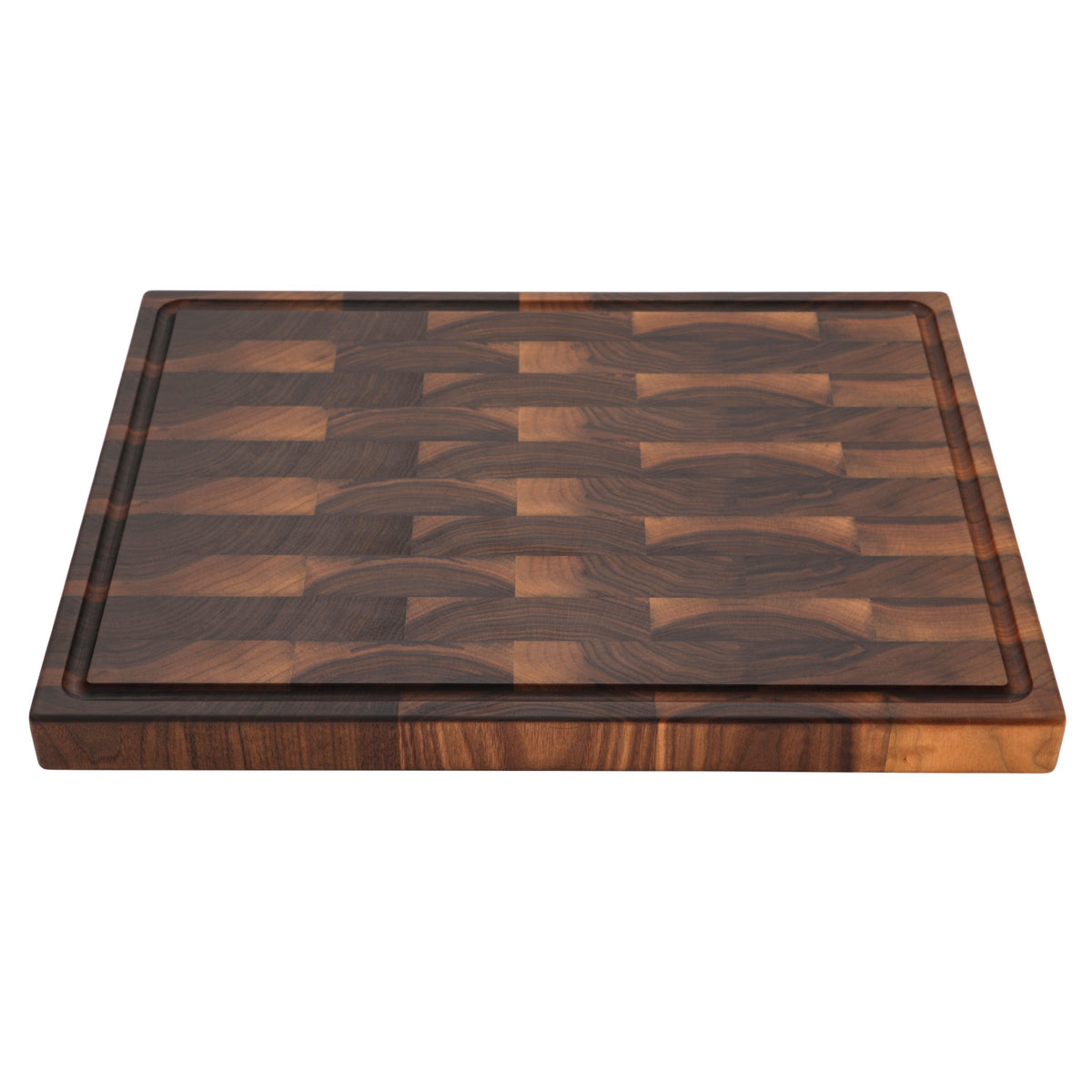 End grain walnut butcher block with a juice groove, 24 x 18 in, low angled view from the near corner