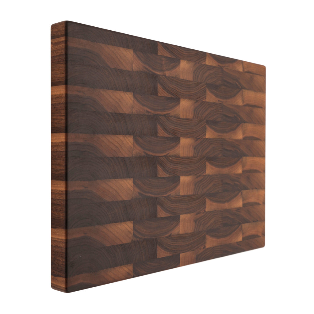 End grain walnut butcher block, 24 x 18 in, propped upright to show the plain face and thick edge