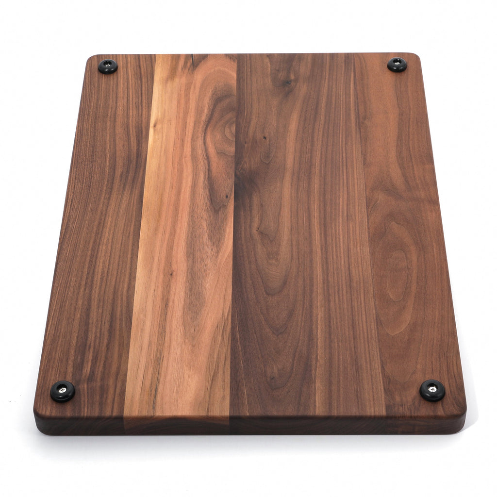 Extra large thick walnut cutting board, 24 x 18 in, angled view of the underside with a pale center plank